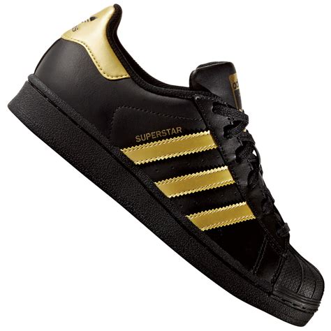 schwarze adidas schuhe mit goldenen streifen|Adidas schwarze schuhe.